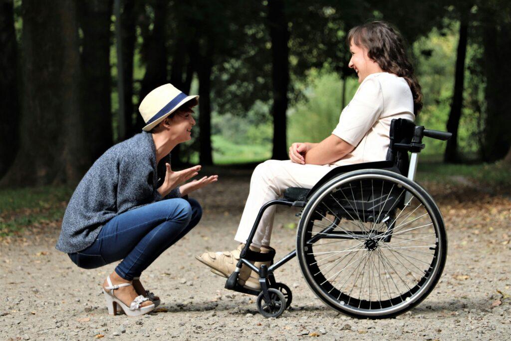 wheelchair-bound friend laughing with friend