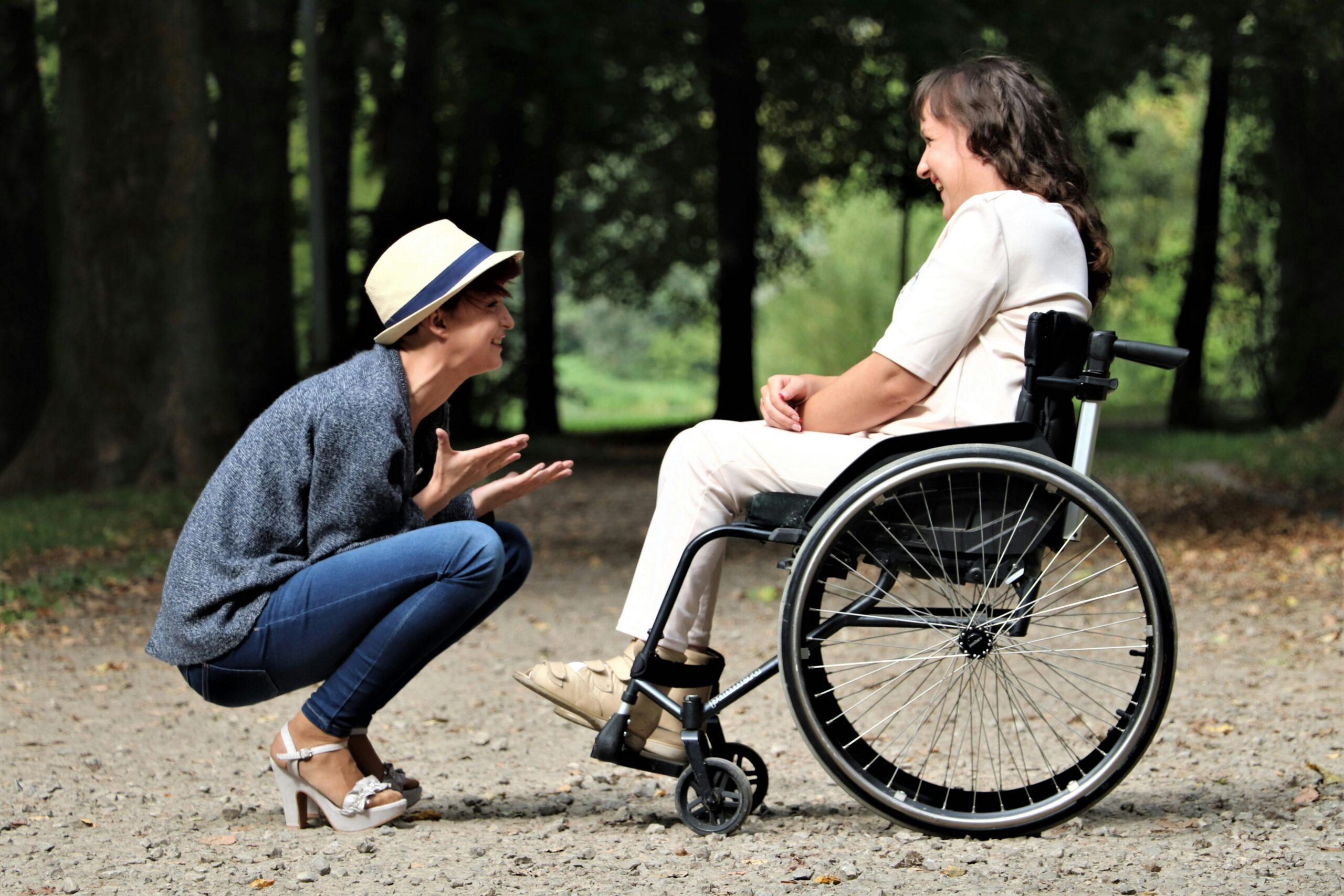 wheelchair-bound friend laughing with friend