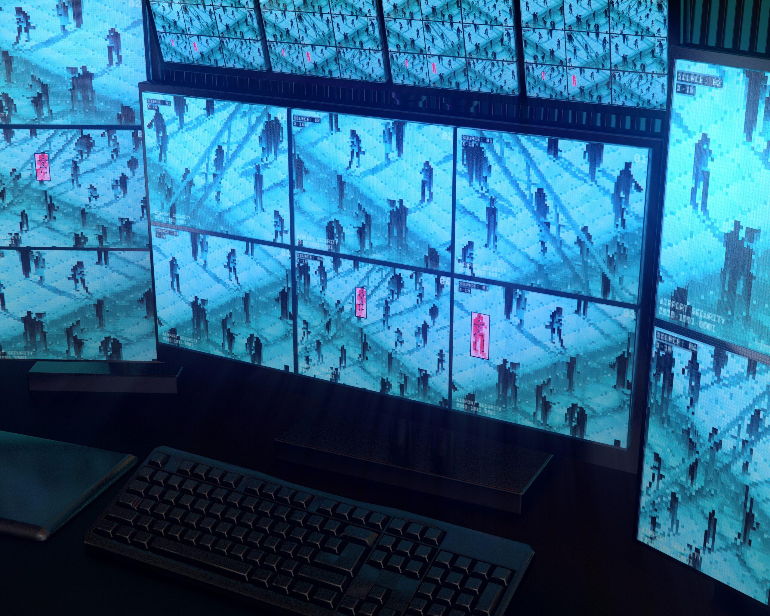 Wall of surveillance monitors displaying multiple blue-tinted CCTV camera feeds of people walking through a public space, with some figures highlighted in red boxes, viewed from a dark control room with a keyboard and desk in the foreground.