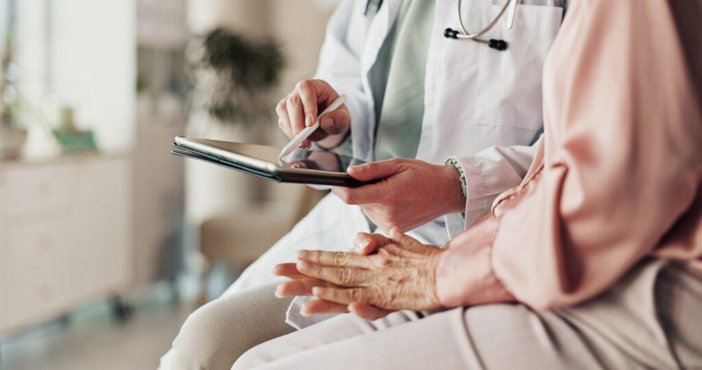 doctor going over chart with patient